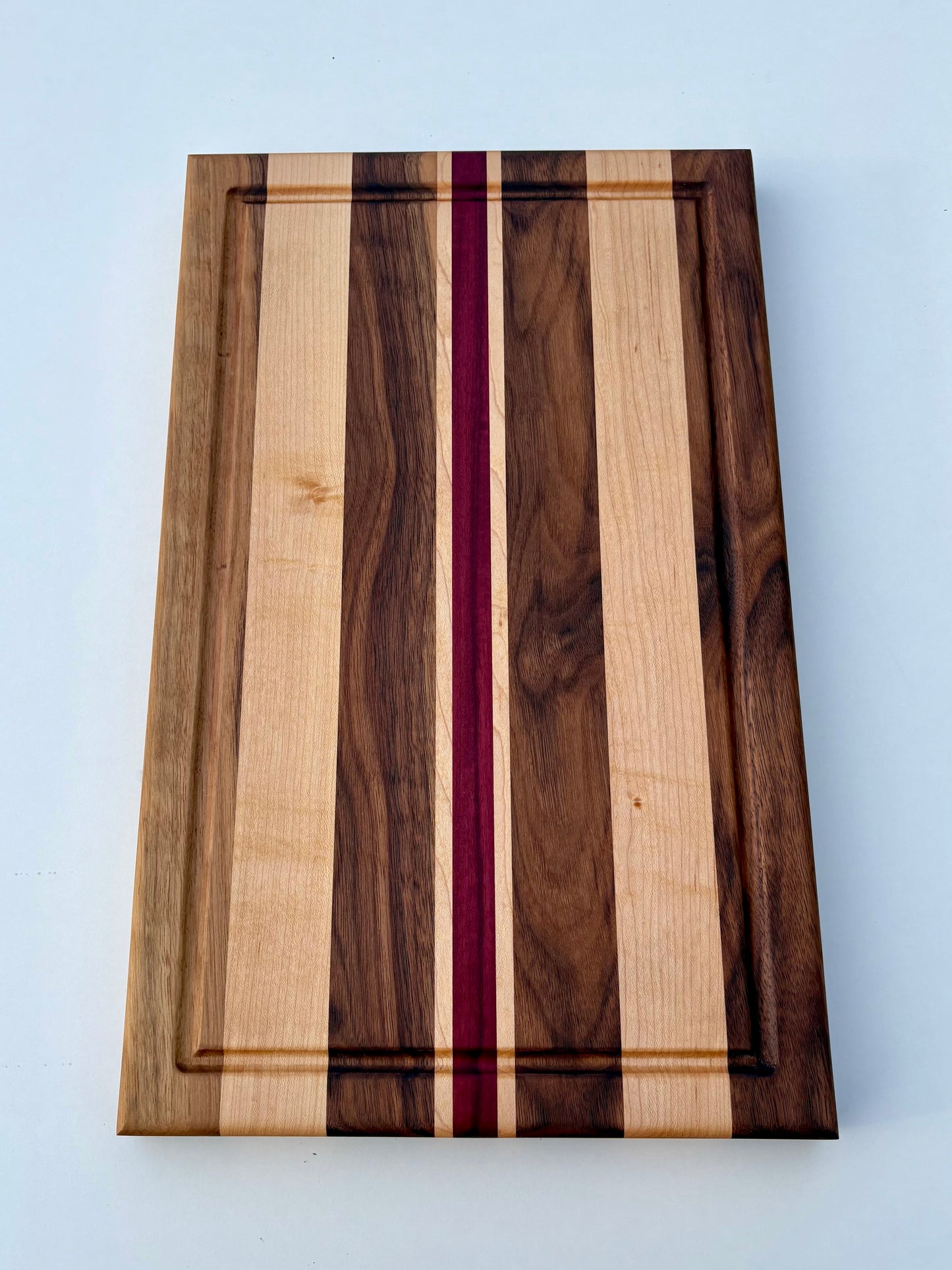 Ready to ship - Walnut, maple and purple heart cutting board